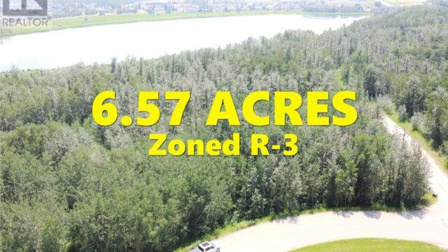 Beautiful location 6.57 acres right across from Innisfail Golf Course